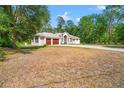 Lovely one story home with columns, an arched entryway and a two car garage at 7340 West Dr, Wesley Chapel, FL 33544
