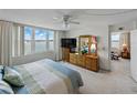 Bright bedroom with a waterfront view and furnishings at 7665 Sun Island S Dr # 307, South Pasadena, FL 33707