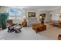 Inviting living area featuring neutral tones, plush seating, and serene water views at 7665 Sun Island S Dr # 307, South Pasadena, FL 33707