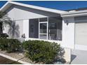 Inviting screened front porch, offering a cozy seating area and protection from the elements at 810 Bluewater Dr, Sun City Center, FL 33573