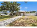 Inviting single-story home with a well-maintained lawn, driveway, and a one-car garage at 109 S Nimbus Ave, Clearwater, FL 33765
