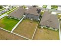 A spacious, fenced backyard with green grass and a playset, perfect for outdoor activities at 13380 Great Plains Dr, Riverview, FL 33579