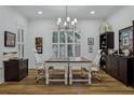 Well-lit home office featuring built in shelving, and a large table at 15704 Mifflin Ct, Tampa, FL 33647