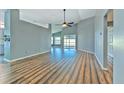 Bright living room featuring sleek wood flooring and a spacious open layout at 1639 Wakefield Dr, Brandon, FL 33511