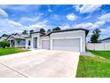 Charming single-story home with well-manicured lawn, two-car garage and a modern design at 18657 Obregan Dr, Spring Hill, FL 34610