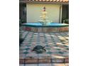 Three tiered fountain in a courtyard with decorative patterned tile flooring and turtle at 2400 Feather Sound Dr # 635, Clearwater, FL 33762