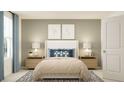 Bedroom with a comfortable bed, matching nightstands, and calming decor at 2691 Buttercup Lucine Ln, Ruskin, FL 33570