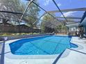 Stunning screened-in pool with plenty of room for outdoor fun and relaxation at 30456 Willow Bank Ave, Brooksville, FL 34602