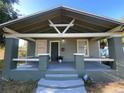 Attractive bungalow with a covered front porch, updated paint and easy front yard access at 3515 E 8Th Ave, Tampa, FL 33605