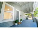 Inviting front porch with fresh plants, welcome mat, and well-maintained features at 3515 E 8Th Ave, Tampa, FL 33605