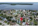 Aerial view of a neighborhood near the water, highlighting a property location with a red pin at 5920 Denver Ne St, St Petersburg, FL 33703
