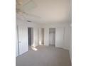 Bright bedroom with closet and neutral carpet at 614 Guild Dr # 15, Venice, FL 34285