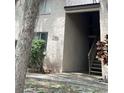 Exterior entrance to the building with stairs leading to the upper levels with the building address posted at 7506 Presley Pl # 107, Tampa, FL 33617