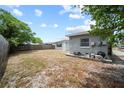 Spacious backyard with a partial fence at 10602 Camelia Dr, Port Richey, FL 34668