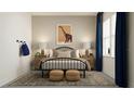 Cozy bedroom with a comfortable bed, stylish decor, and natural light from a window at 11745 E 71St Ter, Palmetto, FL 34221