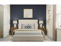 Modern bedroom with sophisticated decor, including a cozy bed and stylish nightstands at 11745 E 71St Ter, Palmetto, FL 34221