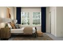 Bright bedroom with two large windows, plush bedding, and an elegant side table at 11745 E 71St Ter, Palmetto, FL 34221