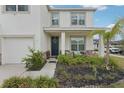 Inviting front porch featuring stylish seating, fresh landscaping, and a welcoming entrance at 13055 Willow Grove Dr, Riverview, FL 33579