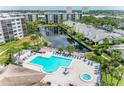 Community pool and lounge area offer a refreshing escape with ample seating and sunny ambiance at 1316 Pasadena S Ave # 303, South Pasadena, FL 33707