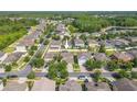 Residential aerial showcasing the neighborhood, nearby lakes, and the home's positioning at 20404 Autumn Fern Ave, Tampa, FL 33647