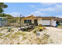 Charming single-story home with a cozy front yard featuring a lovely garden and a covered entrance at 2078 Shadow Ln, Clearwater, FL 33763