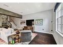 Spacious living room with hardwood floors, modern decor, and a cozy seating area at 2305 Victoria Gardens Ln, Tampa, FL 33609