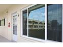 Patio view showcasing the building's architectural style and outdoor access, plus a glimpse of the surroundings at 2360 World Parkway Blvd # 36, Clearwater, FL 33763