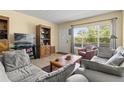 Inviting living room with large window, comfortable seating, and stylish furnishings creating a relaxing atmosphere at 2426 Persian Dr # 52, Clearwater, FL 33763