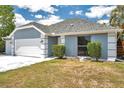 Charming home featuring a two-car garage, neutral paint scheme, and well-manicured landscaping at 3558 65Th Avenue E Cir, Sarasota, FL 34243