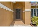 Inviting front entrance with a decorative wreath and neutral colors at 4410 Foxboro Dr, New Port Richey, FL 34653
