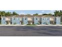 Charming two-story townhomes with attached garages and manicured lawns on a sunny day at 4419 Rachel Falls Dr, Tampa, FL 33610