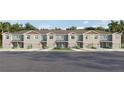 Charming two-story townhomes with attached garages and manicured lawns in a peaceful setting at 4419 Rachel Falls Dr, Tampa, FL 33610