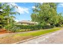 Well-maintained house with lush green lawn and mature landscaping. Brick road provides curb appeal at 509 N Walker St, Plant City, FL 33563