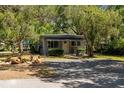 Charming home featuring mature trees, a well-kept yard, and cozy curb appeal at 5421 Gay St, Weeki Wachee, FL 34607
