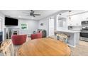 Spacious open-concept featuring living room, dining space, and kitchen, perfect for entertaining and comfortable living at 5421 Gay St, Weeki Wachee, FL 34607