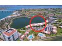 Stunning aerial view of waterfront condos with community pools and convenient parking spaces at 6290 Bahia Del Mar Cir # 12, St Petersburg, FL 33715