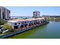 Waterfront condos featuring private balconies and a tranquil view of the surrounding lake and beautifully kept grounds at 6290 Bahia Del Mar Cir # 12, St Petersburg, FL 33715