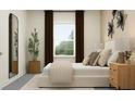 Comfortable bedroom featuring a view from the window, plant, and contemporary decor at 6905 E 116Th Ct, Palmetto, FL 34221