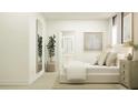 Light, airy bedroom with full length mirror, potted tree, framed artwork, and a closet at 6909 E 116Th Ct, Palmetto, FL 34221