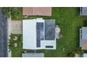 Aerial view of the home showcasing the roof with solar panels and backyard patio area at 9743 36Th N Way # 4, Pinellas Park, FL 33782