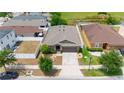 Single-story home with fenced yard, landscaping, and a long driveway at 10626 Laguna Plains Dr, Riverview, FL 33578
