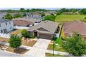 Well-maintained single-story home with neat landscaping, and an attached garage at 10626 Laguna Plains Dr, Riverview, FL 33578