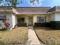 Inviting single-story home with covered entry, manicured bushes, and a neatly kept lawn at 1654 S Lake Ave # 2, Clearwater, FL 33756