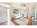 Bright living room featuring a large window, neutral decor, and stylish furnishings creating a welcoming atmosphere at 1719 Bayhill Dr, Oldsmar, FL 34677