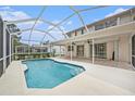 Inviting screened-in pool area perfect for relaxation and entertainment with a covered patio and spacious deck at 1719 Bayhill Dr, Oldsmar, FL 34677