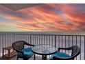 Enjoy breathtaking ocean views from this condo balcony with comfortable seating, perfect for relaxing and entertaining at 18650 Gulf Blvd # 313, Indian Shores, FL 33785
