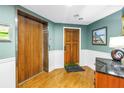 Well-maintained lobby with wood door and elevator access to resident condos at 19910 Gulf Boulevard # 102, Indian Shores, FL 33785
