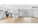 Open-concept living space with updated kitchen featuring stainless steel appliances at 2921 N 18Th St, Tampa, FL 33605