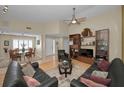 Open living room with hardwood floors, modern lighting, and dining area view at 3079 Landmark Blvd # 1608, Palm Harbor, FL 34684