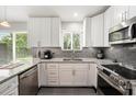 Bright, modern kitchen featuring granite countertops and stainless steel appliances at 3268 Tanglewood Trl, Palm Harbor, FL 34685